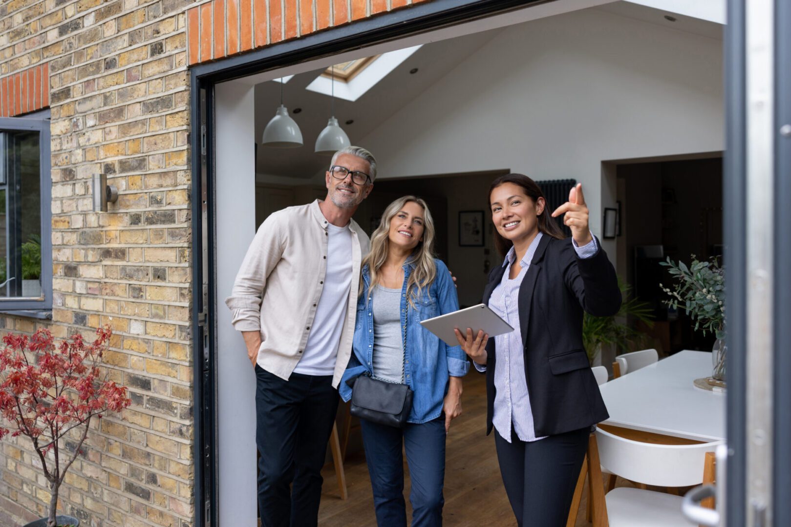 Real estate agent showing couple a house.