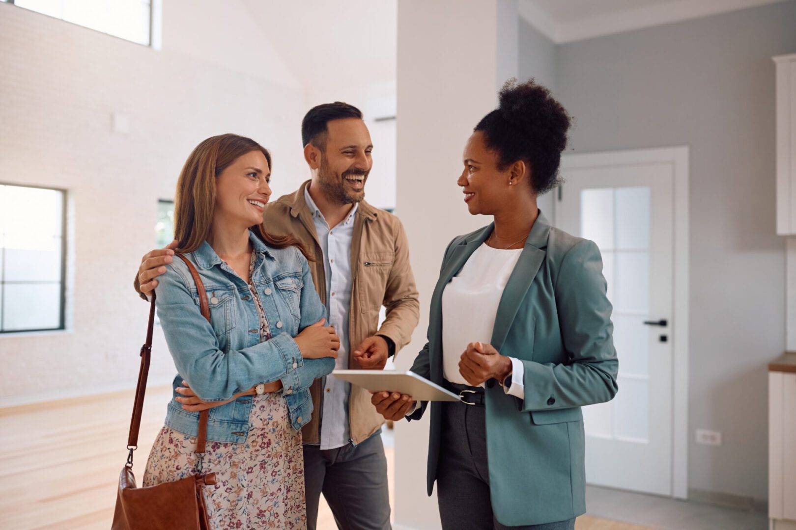 Couple meeting with a real estate agent.