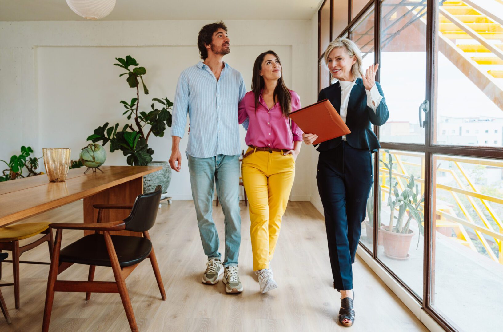 Real estate agent showing couple a home.